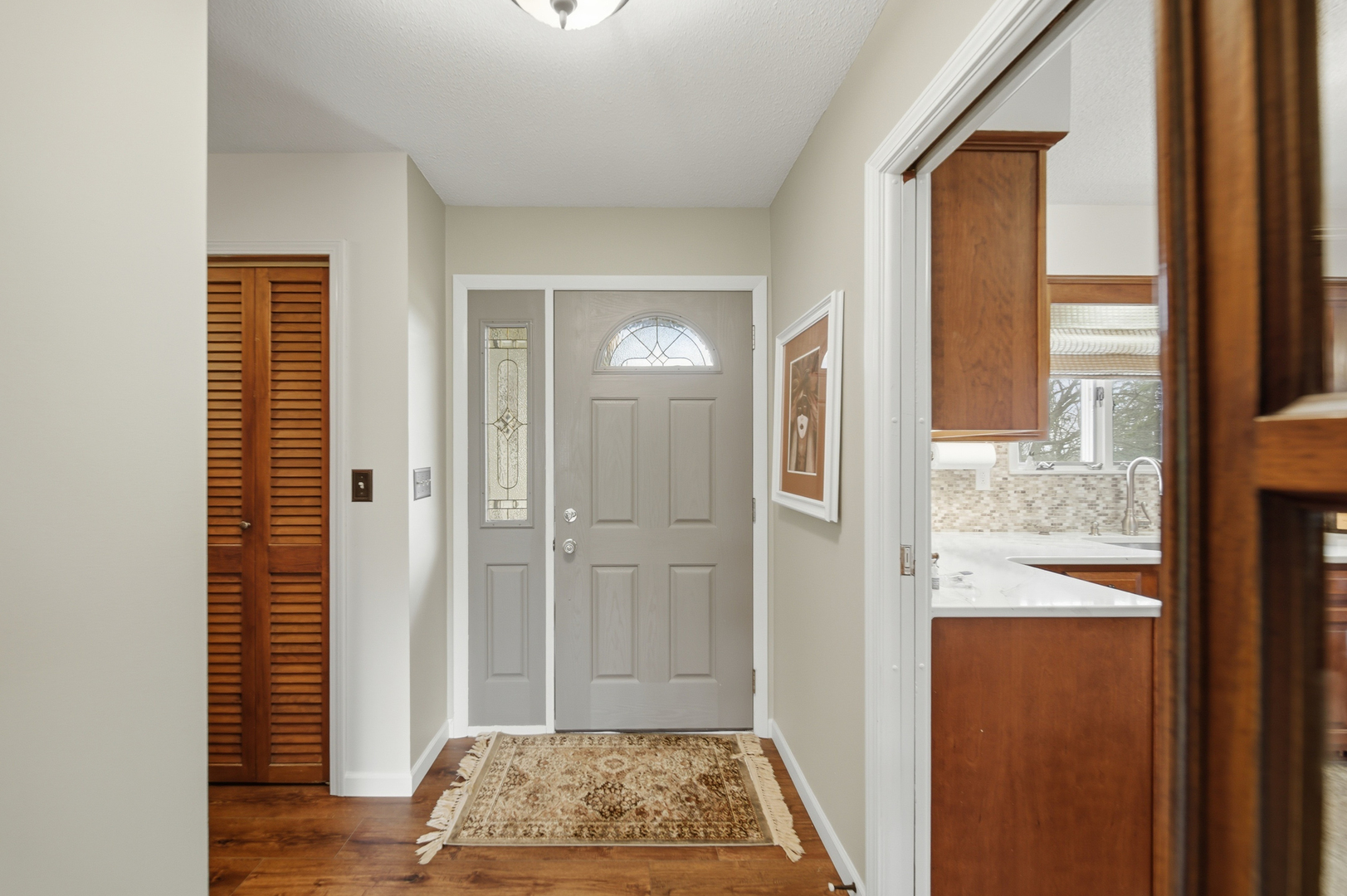 476 Timberland Drive Dixon, IL 61021 - Photo 11 of 32 a view of a hallway with wooden floor and a livingroom