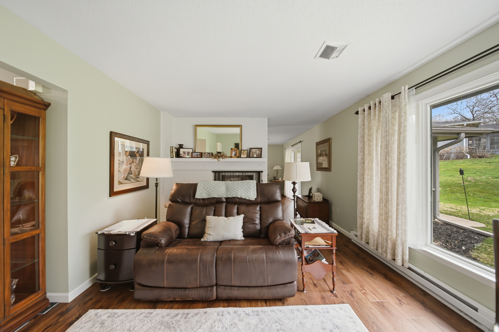 476 Timberland Drive Dixon, IL 61021 - Photo 15 of 32 a living room with furniture and a fireplace