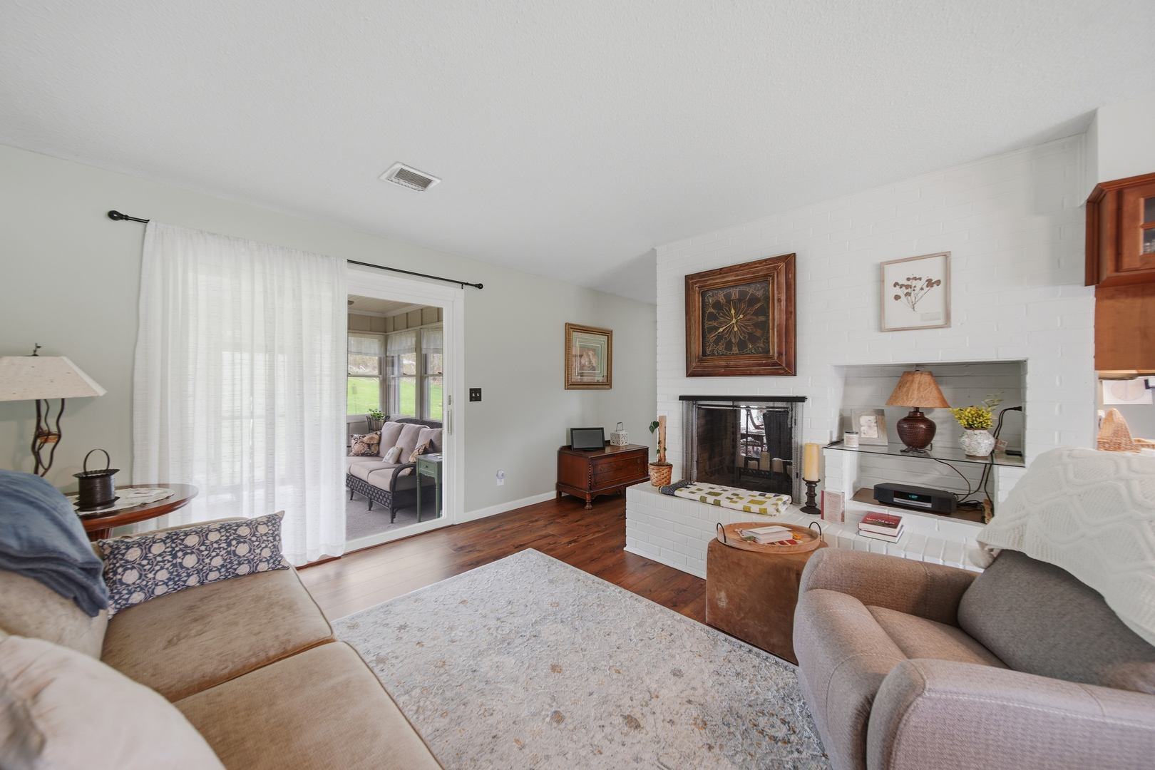 476 Timberland Drive Dixon, IL 61021 - Photo 21 of 32 a living room with furniture window and a fireplace