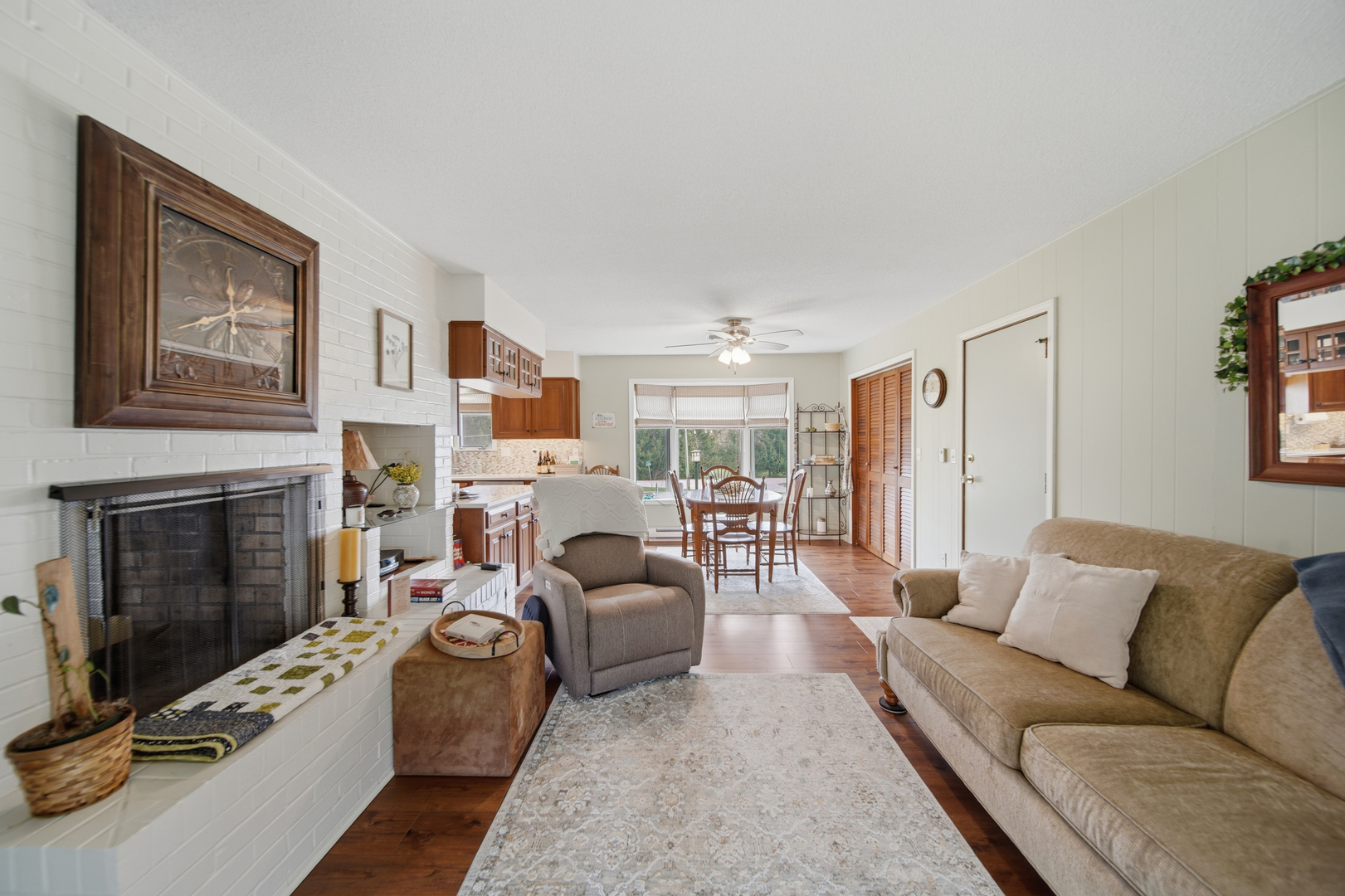 476 Timberland Drive Dixon, IL 61021 - Photo 22 of 32 a living room with furniture a fireplace and a flat screen tv