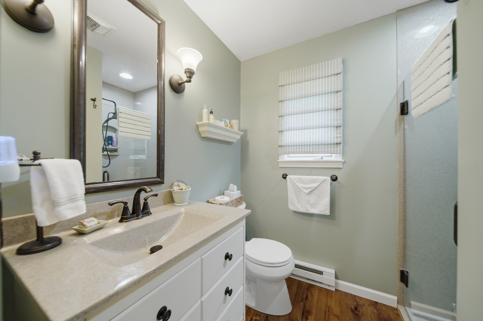 476 Timberland Drive Dixon, IL 61021 - Photo 29 of 32 a bathroom with a sink a toilet and a mirror