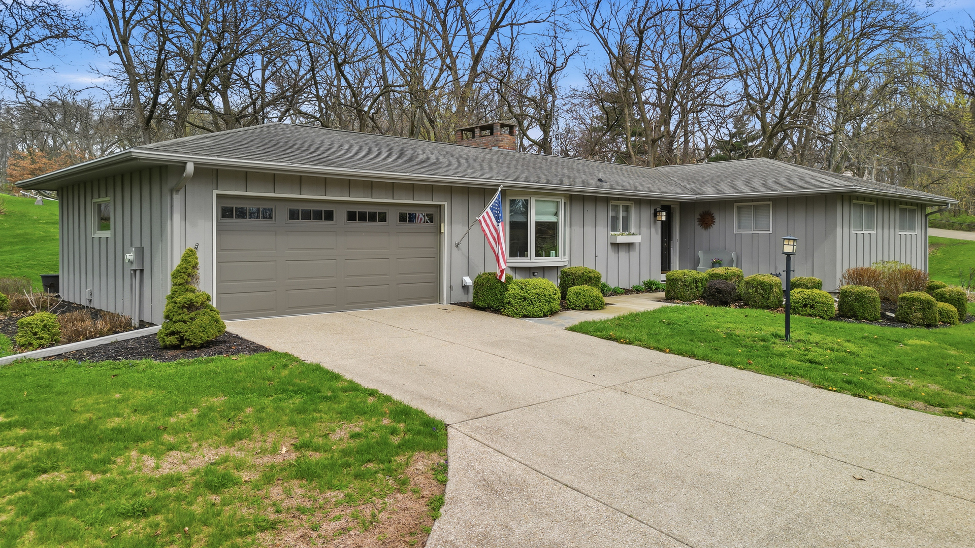 476 Timberland Drive Dixon, IL 61021 - Photo 3 of 32 a front view of a house with a yard and garage