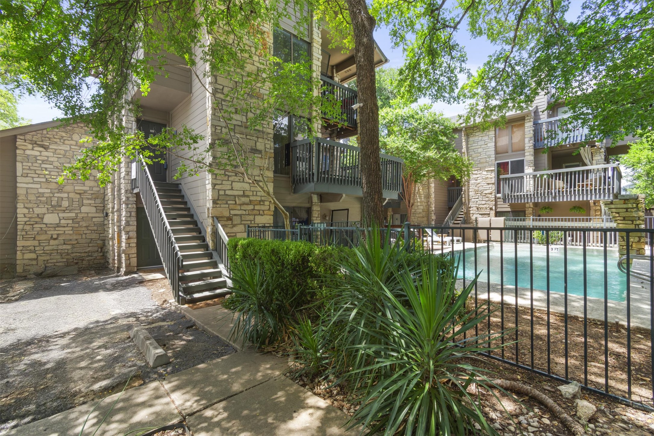 3627 Menchaca Road, Unit 204 Austin, TX 78704 - Photo 1 of 23 The staircase will take you to the front door of the condo. The two balconies above the pool closest to the staircase are the balconies from this condo.