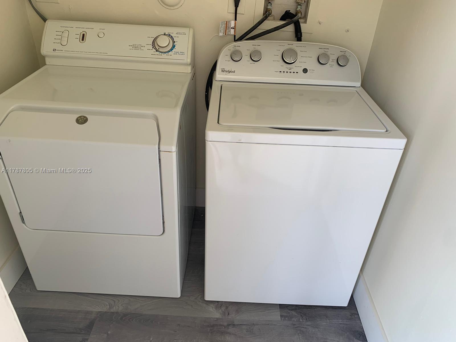451 Northeast 207th Lane, Unit 102 Miami, FL 33179 - Photo 8 of 8 a utility room with dryer and washer