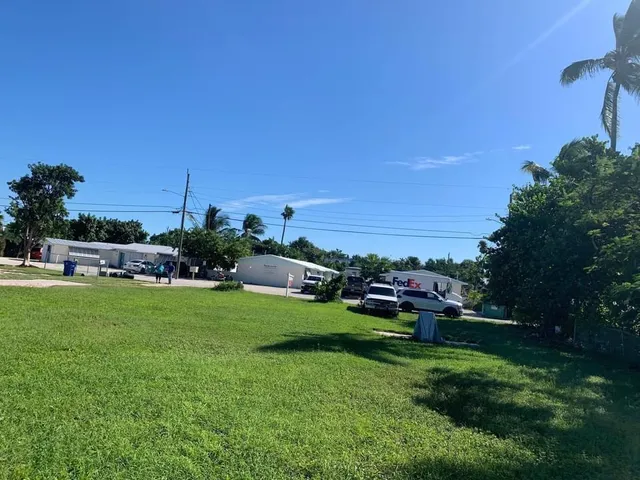 a view of a garden with houses