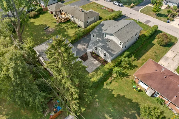 an aerial view of residential houses with outdoor space