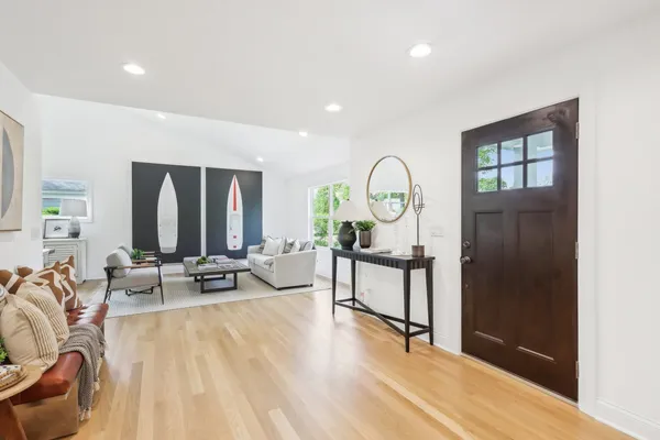 a view of a livingroom with furniture and wooden floor