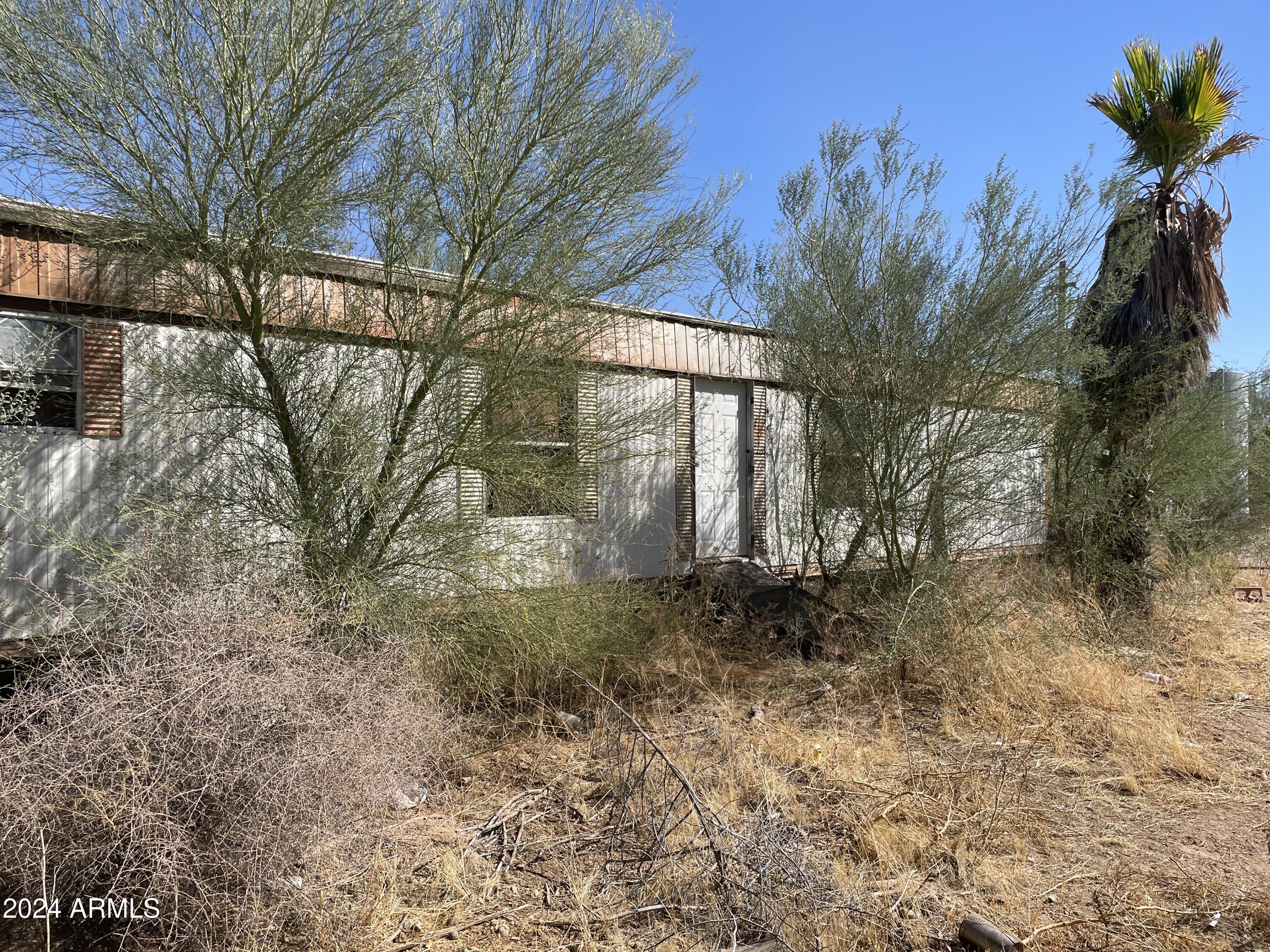 857 South Maricopa Road Maricopa, AZ 85139 - Photo 2 of 2 a view of a yard with a tree