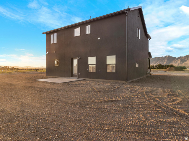 1267 West 2350 South Perry, UT 84302 - Photo 8 of 35 Two-story structure featuring dark-toned siding and multiple windows