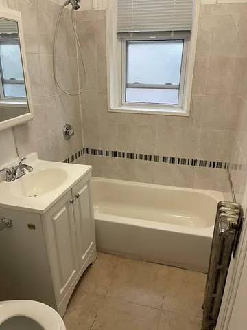 a bathroom with a sink a toilet and a bathtub