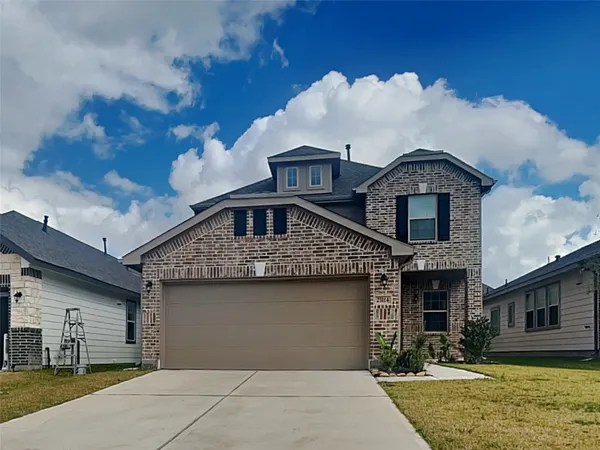 a front view of a house with garage