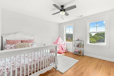 a bedroom with furniture and window
