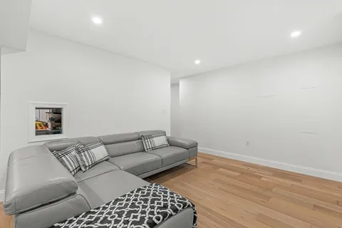 a living room with a couch and a rug