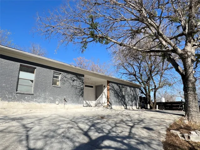 a view of a house with a snow in the yard