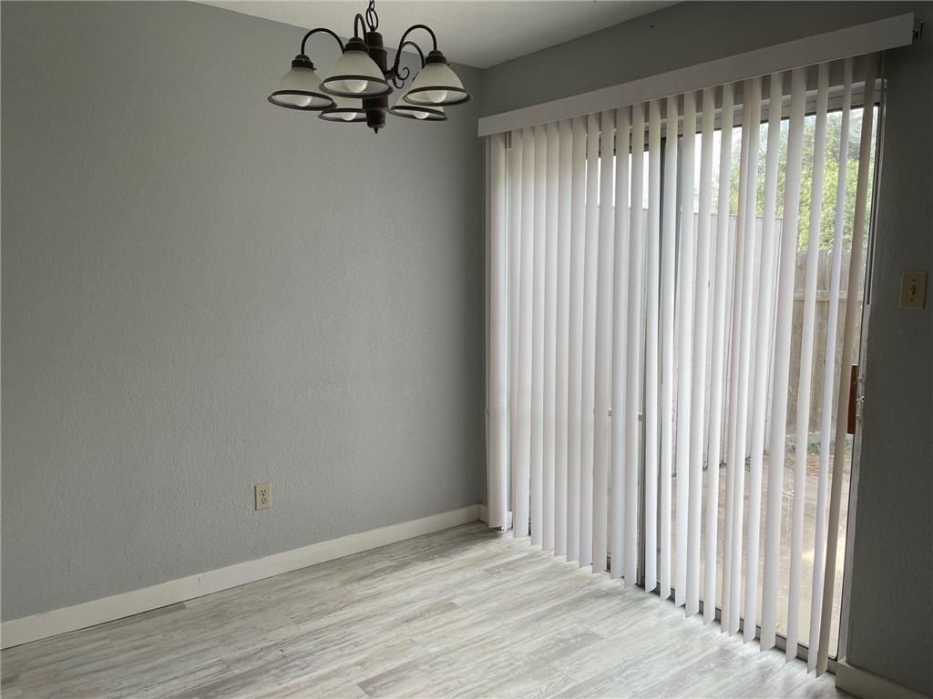 11605 Post Oak Circle, Unit 2 Corpus Christi, TX 78410 - Photo 5 of 7 a view of an empty room with a window
