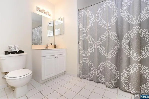 a bathroom with a toilet sink and shower