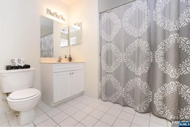 a bathroom with a toilet sink and shower