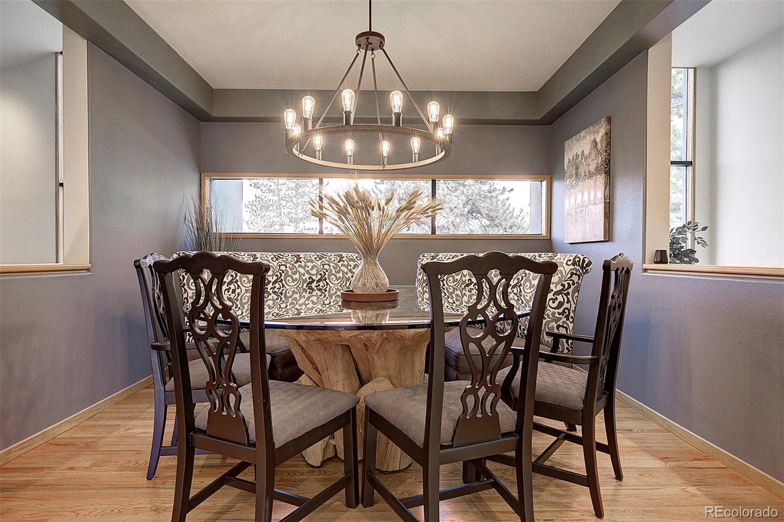 2040 Werner Lane Evergreen, CO 80439 - Photo 14 of 47 a view of a dining room with furniture window and wooden floor