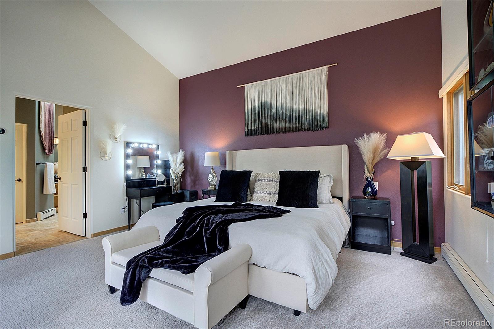 2040 Werner Lane Evergreen, CO 80439 - Photo 28 of 47 a bedroom with a bed and a mirror