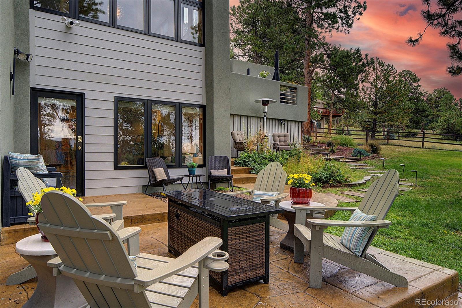 2040 Werner Lane Evergreen, CO 80439 - Photo 42 of 47 a view of a patio with table and chairs and potted plants