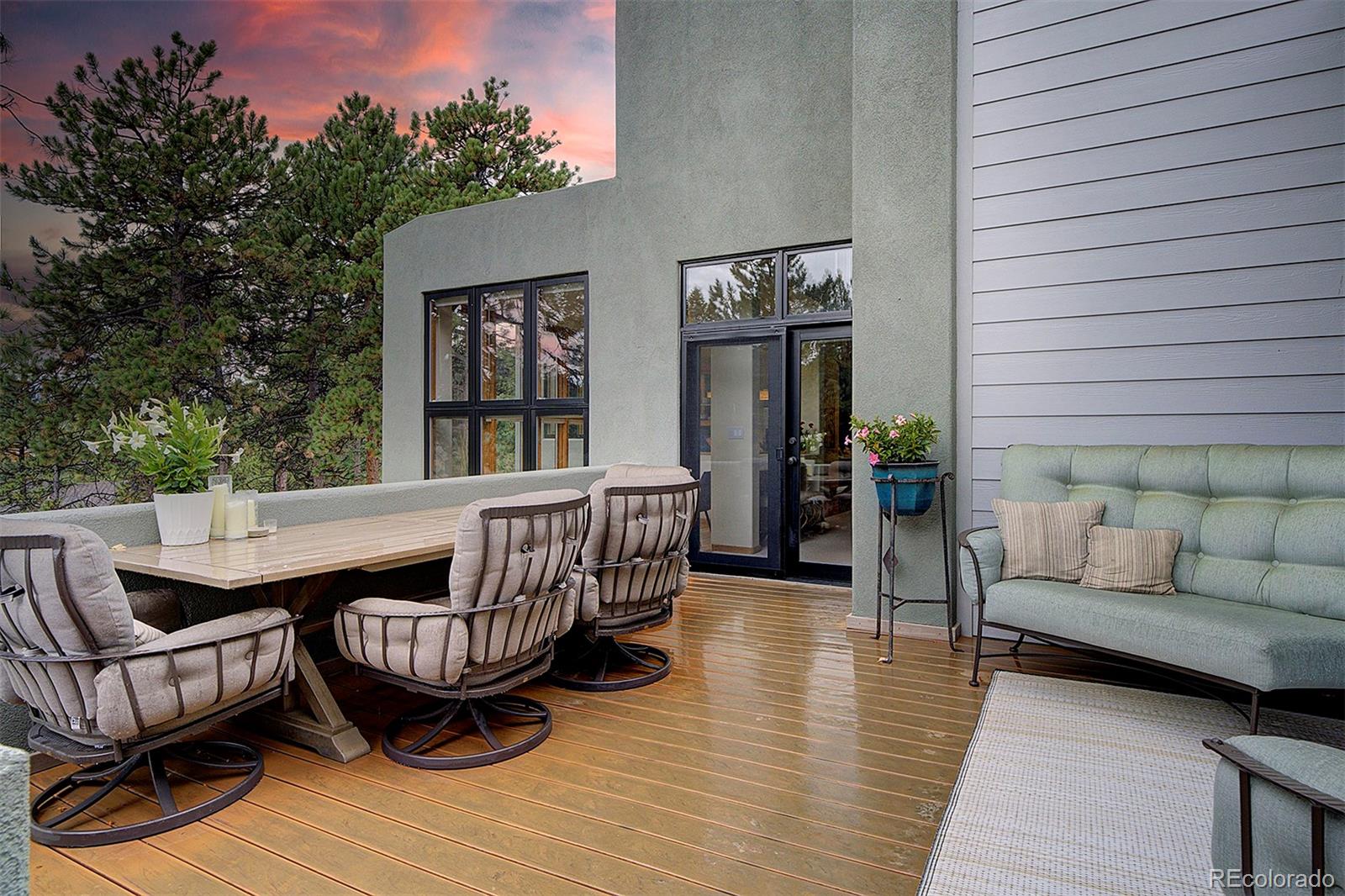 2040 Werner Lane Evergreen, CO 80439 - Photo 43 of 47 an outdoor sitting area with furniture and wooden floor