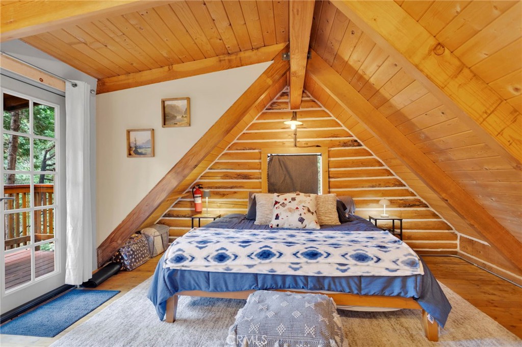 788 Buckingham Square Lake Arrowhead, CA 92352 - Photo 12 of 61 a bedroom with a bed and wooden floor