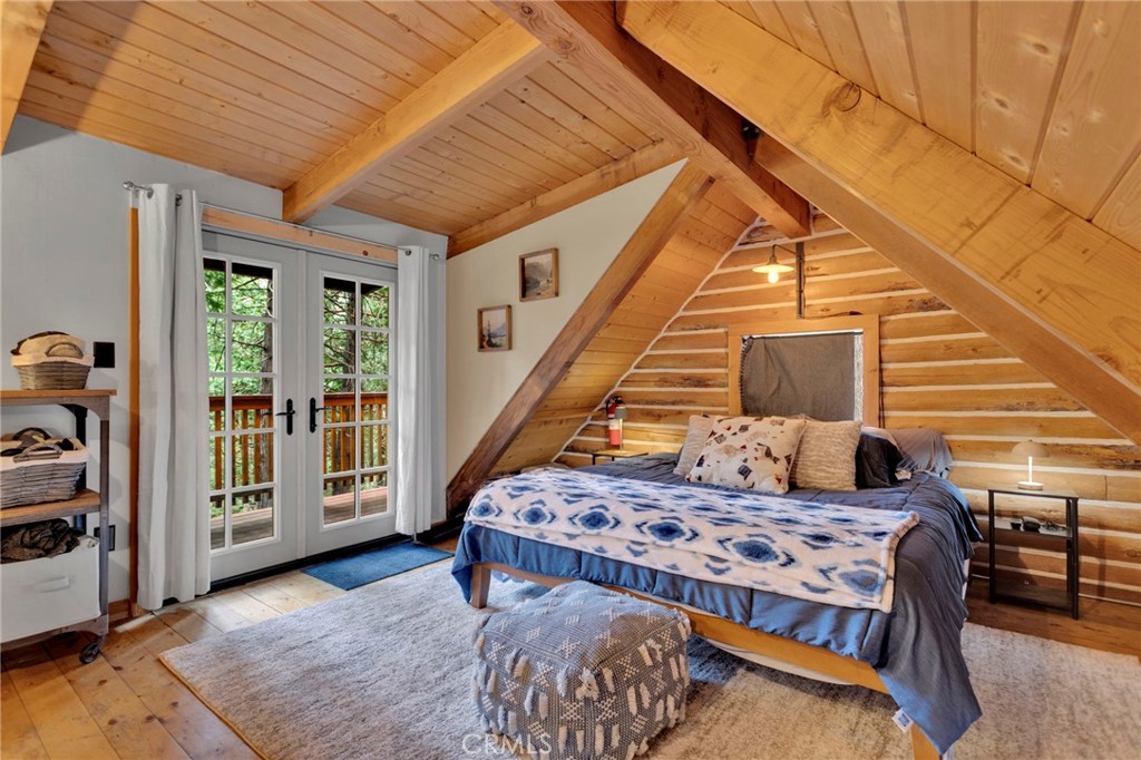 788 Buckingham Square Lake Arrowhead, CA 92352 - Photo 13 of 61 a bedroom with furniture and large windows