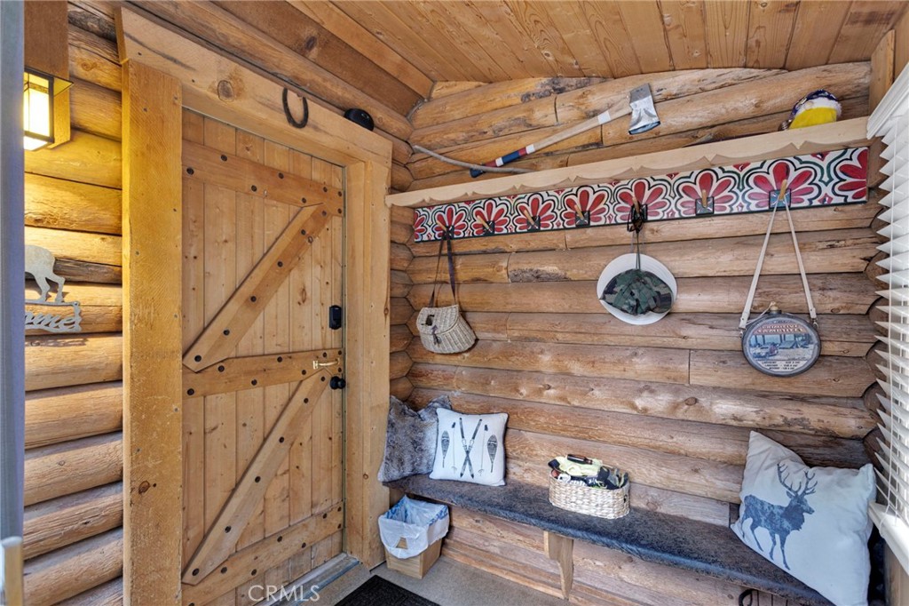788 Buckingham Square Lake Arrowhead, CA 92352 - Photo 2 of 61 a view of entryway with a wooden wall