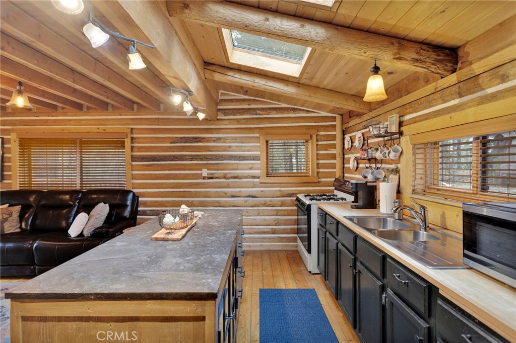 788 Buckingham Square Lake Arrowhead, CA 92352 - Photo 23 of 61 a kitchen with sink stove and cabinets