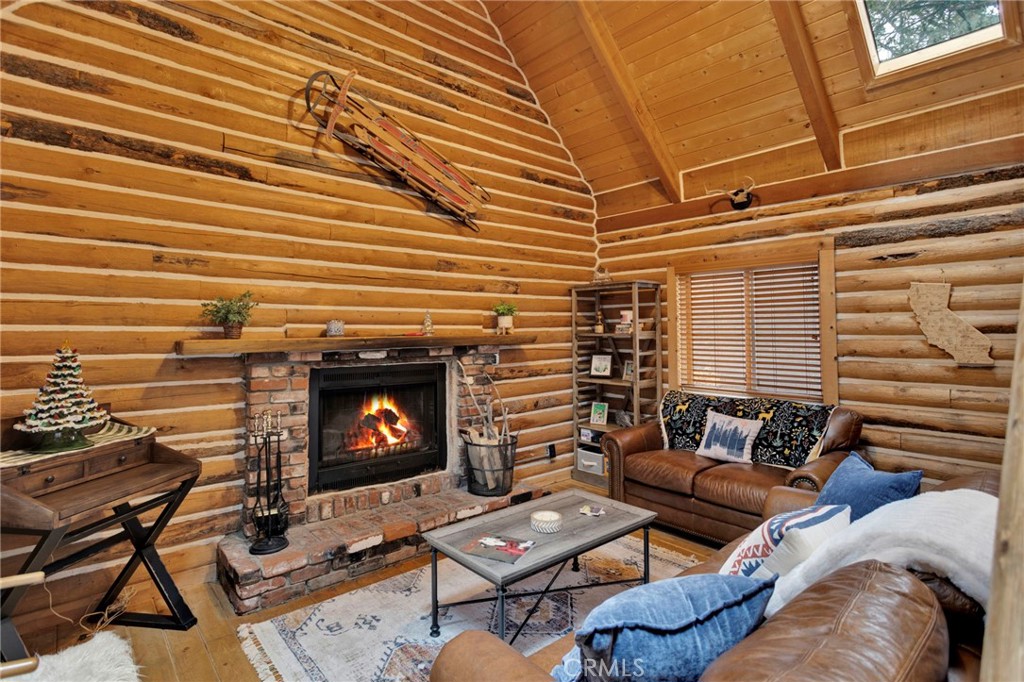 788 Buckingham Square Lake Arrowhead, CA 92352 - Photo 5 of 61 a living room with furniture and a fireplace