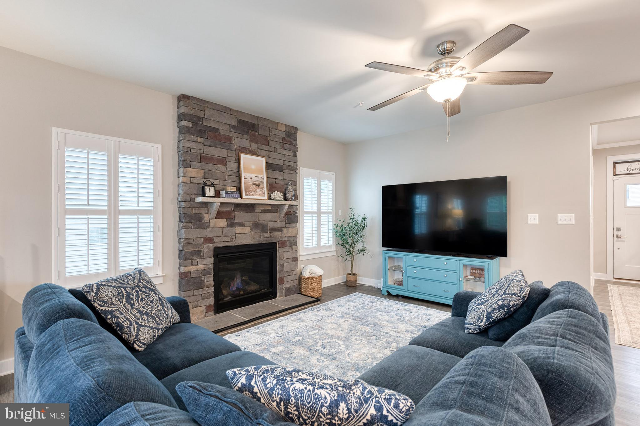 6003 Valentine Way Hanover, MD 21076 - Photo 8 of 52 a living room with furniture and a flat screen tv