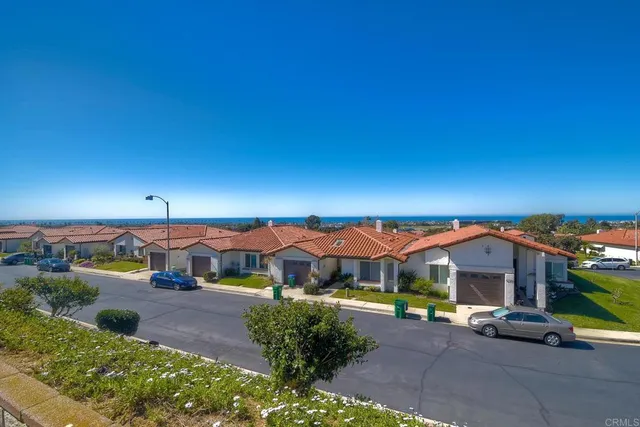 a view of ocean with a big yard