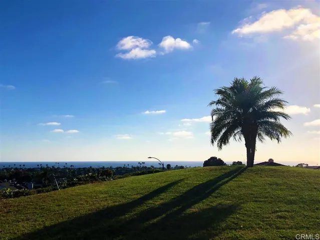 a swimming pool with outdoor seating and yard