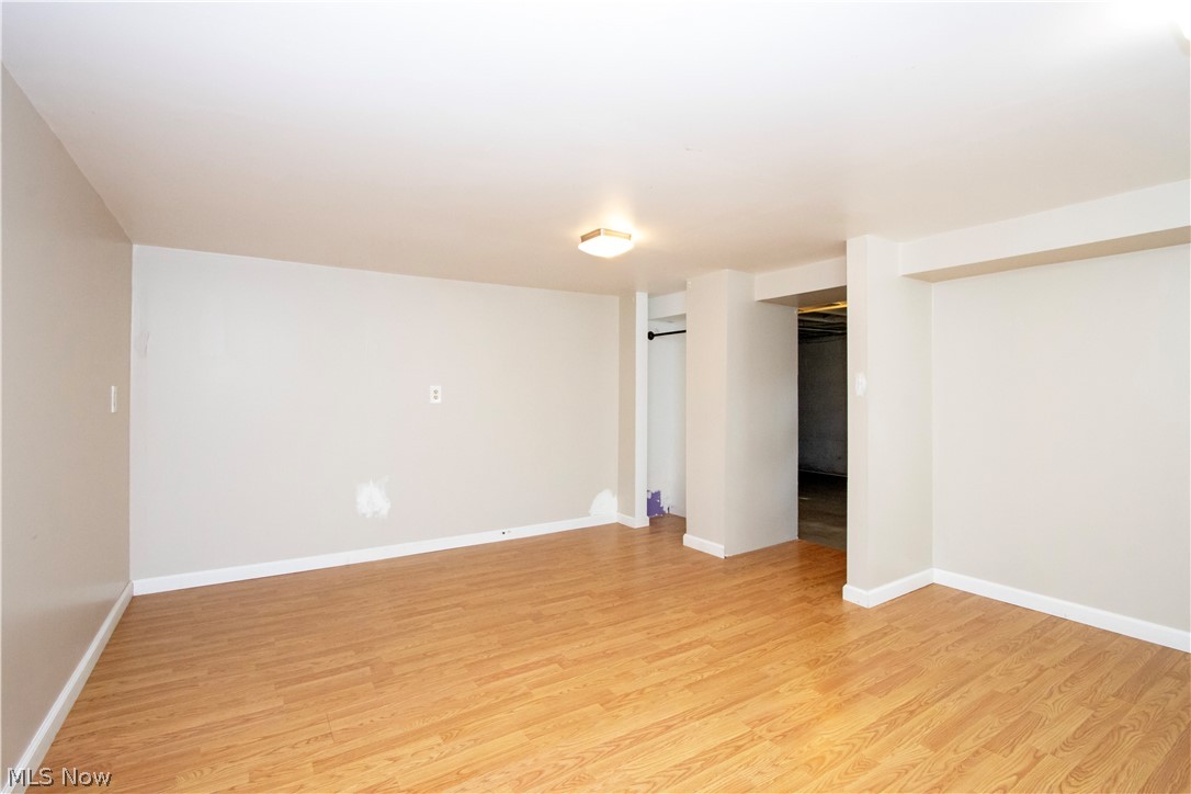 310 North Seneca Street Rittman, OH 44270 - Photo 22 of 28 Unfurnished bedroom featuring a closet and light wood finished floors