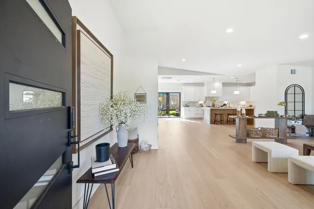 a view of kitchen with furniture and wooden floor