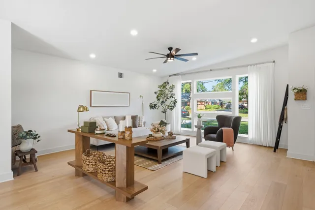 a living room with furniture and a large window