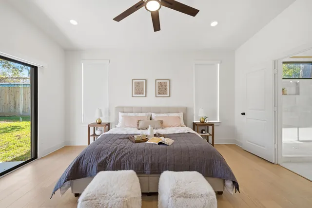 a bedroom with a bed and window