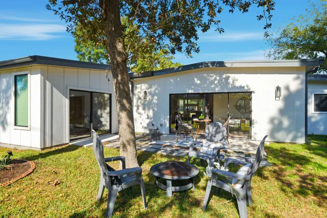 a view of an house with backyard porch and patio