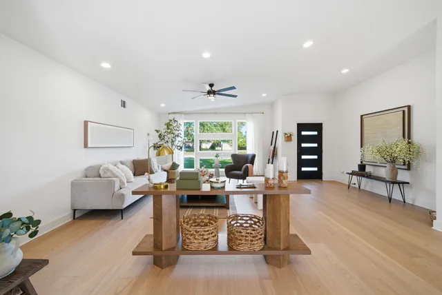 a living room with furniture and a large window