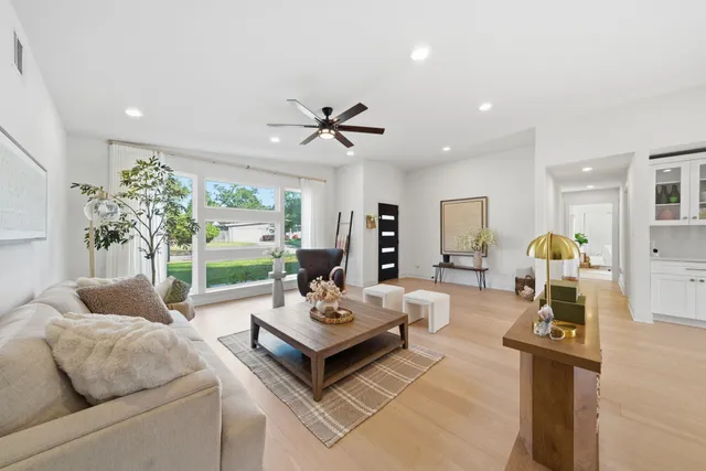 a living room with furniture and a large window