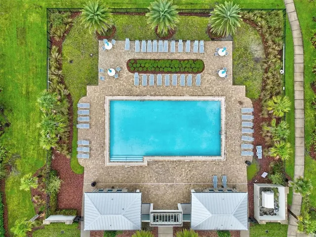 a kitchen with a sink a counter space and a refrigerator