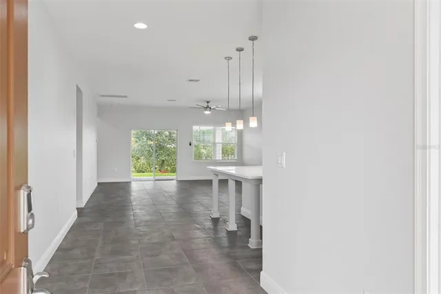 a kitchen with kitchen island a sink stainless steel appliances and cabinets