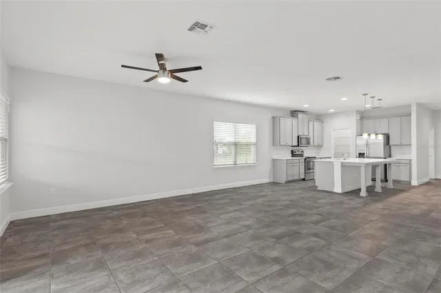 a bathroom with a shower sink and mirror