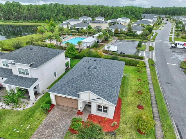 an aerial view of multiple houses with yard