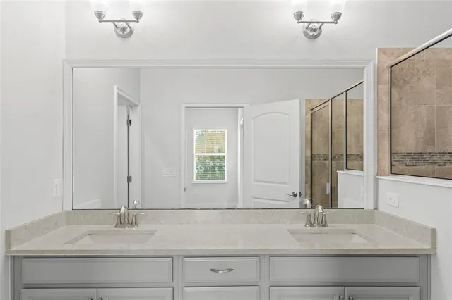 a view of a big room with a large window and front door