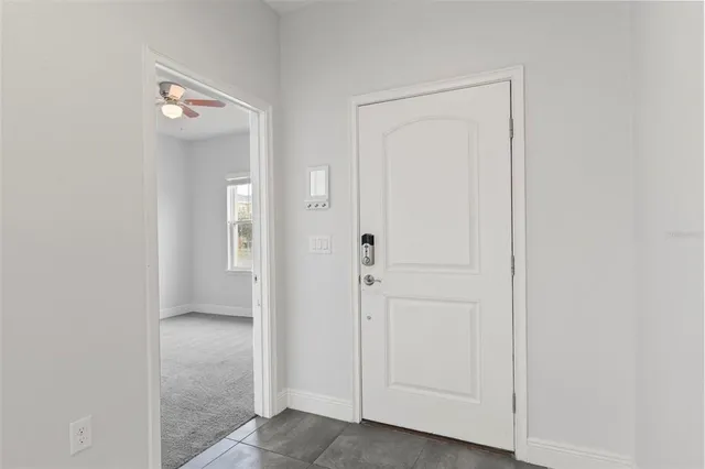 a picture of a room with a white wall and next to a white wall