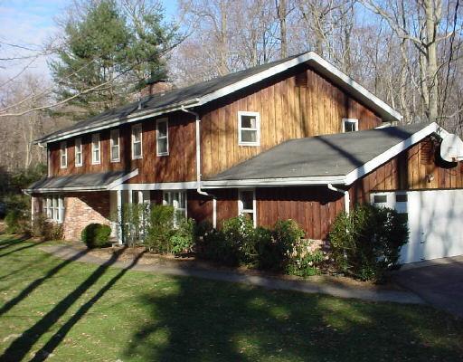 141 Country Club Road Stamford, CT 06903 - Photo 1 of 1 a front view of house with yard and green space