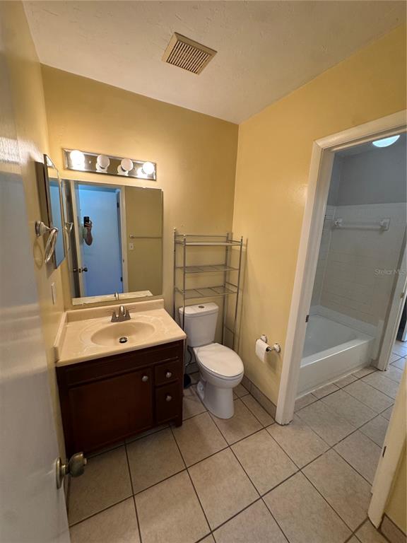 4411 Southwest 34th Street, Unit 1001 Gainesville, FL 32608 - Photo 11 of 20 a bathroom with a sink and mirror