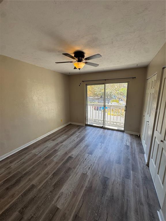 4411 Southwest 34th Street, Unit 1001 Gainesville, FL 32608 - Photo 16 of 20 wooden floor in an empty room with a window