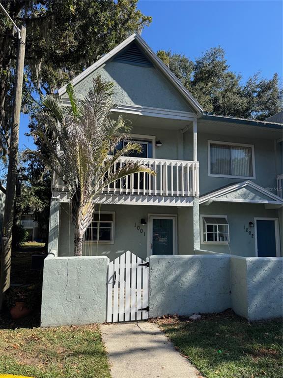 4411 Southwest 34th Street, Unit 1001 Gainesville, FL 32608 - Photo 3 of 20 front view of a house with a street